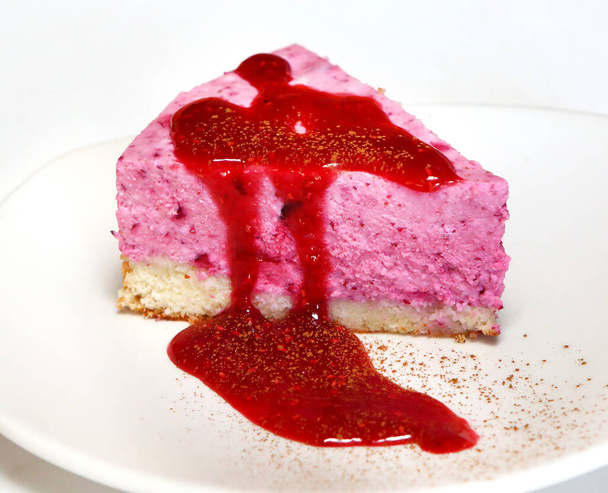 Berry souffle on a biscuit pillow with cherry sauce and cinnamon. - Photo, Image