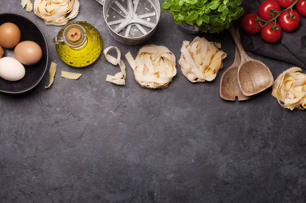 Homemade pasta making on stone table. Top view with copy space. Flat lay - Photo, Image