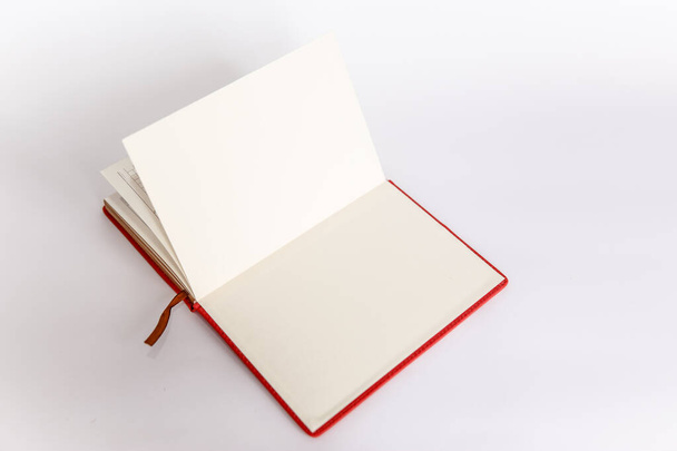 Copy space. Open red daily notebook book on white background - Fotoğraf, Görsel