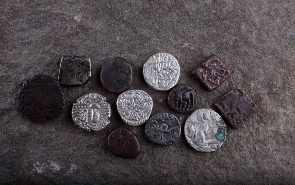 Ancient Indian coins on stone - Valokuva, kuva