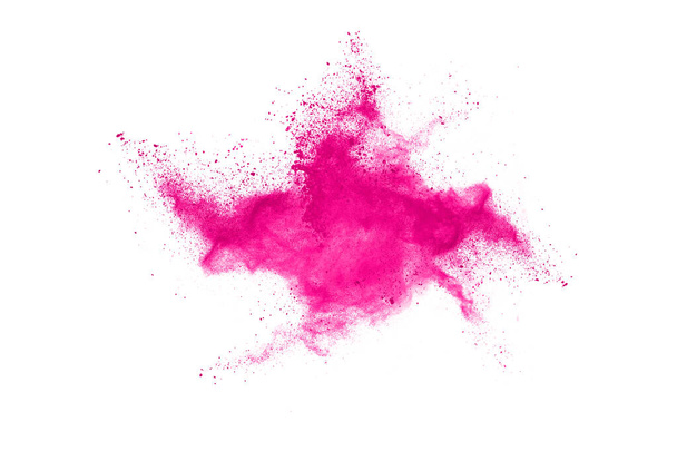 Fondo salpicado de polvo rosa abstracto, congelar el movimiento del polvo de color que explota / lanza polvo de color, textura de brillo de color sobre fondo blanco. - Foto, imagen