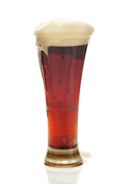 dark beer with the foam in a tall glass isolated on white - Foto, Imagen