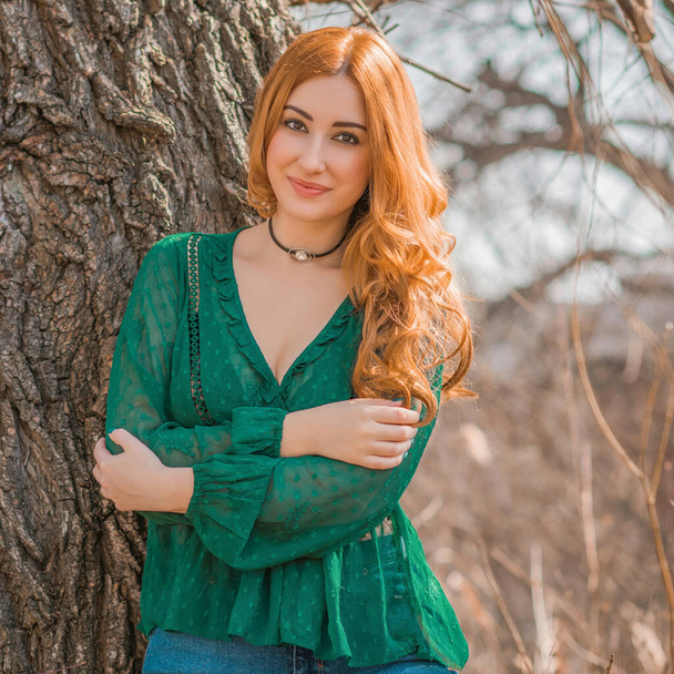 Modern vintage style,redhead woman in green blouse - 写真・画像