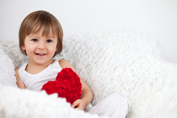 Little baby boy with red heart - Φωτογραφία, εικόνα