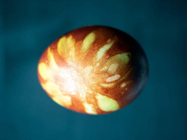 One colored Easter egg close-up on a dark backgroun - Photo, Image