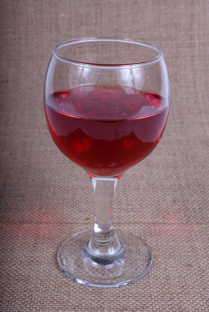 Wine glass on bagging - Photo, image