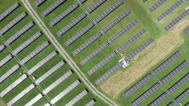 Aerial view of solar power station. Aerial top view of solar farm. Concept of clean energy, green energy, renewable energy. Alternative energy concept. Photovoltaic panels.  - Footage, Video