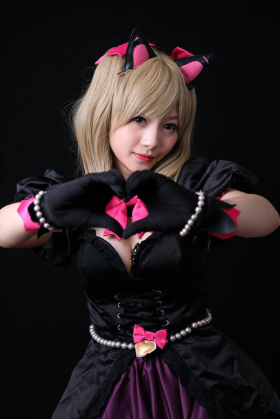 Portrait of Japan anime cosplay girl isolated in black background - Zdjęcie, obraz