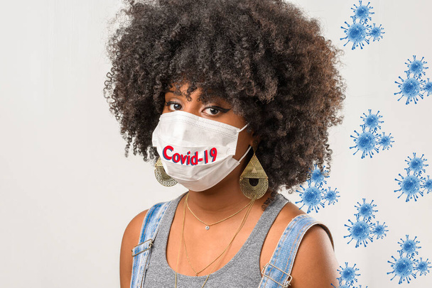 コロナウイルスパンデミックcovid-19の保護マスクをした少女 - 写真・画像