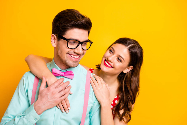Closeup photo two people attractive lady handsome guy prom party couple hugging posing portrait look eyes wear red dress shirt bowtie retro clothes isolated yellow bright color background - Φωτογραφία, εικόνα