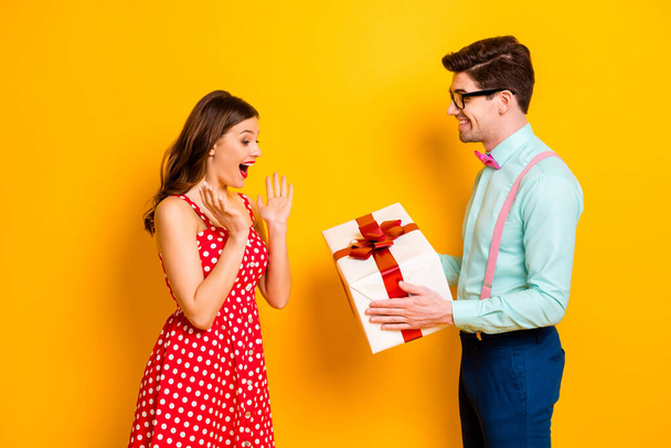 Portrait excited shocked girl have 14-february date her spouses stylish man geek give desire wish present wear red dotted dress blue shirt suspenders isolated bright shine color background - Foto, imagen
