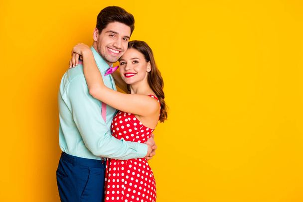 Profile photo two people pretty lady handsome guy prom party couple hugging posing portrait wear red dotted dress shirt bowtie retro clothes isolated yellow bright color background - Φωτογραφία, εικόνα
