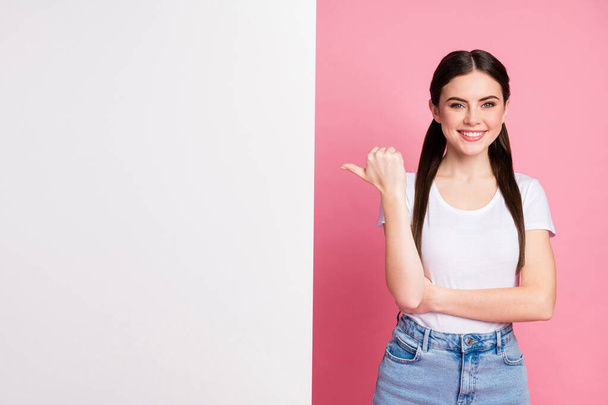 Portrait of her she nice attractive lovely charming confident glad cheerful cheery girl demonstrating new novelty copy space decision solution isolated over pink pastel color background - 写真・画像