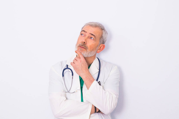 adult or senior doctor with beard and stethoscope isolated on white - Photo, Image