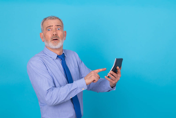 adult business man with calculator isolated on background - Foto, immagini