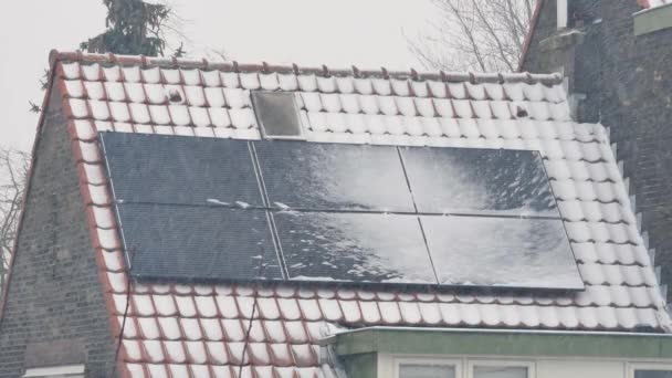 Snowing on solar panels at roof of house - Footage, Video