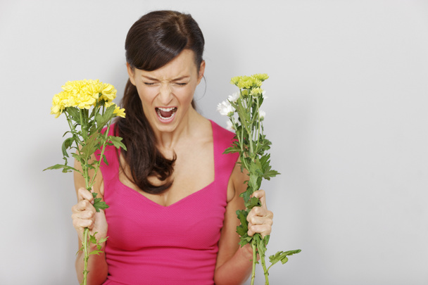 Woman angry with flowers - Фото, зображення