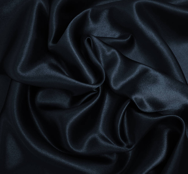 Smooth elegant black silk or satin texture can use as abstract background. Luxurious background design - Photo, Image