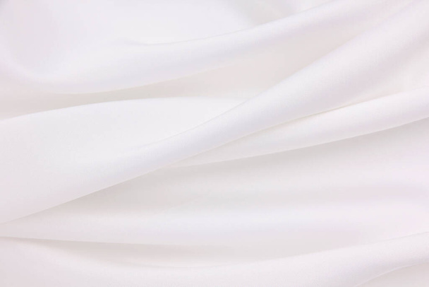 Smooth elegant white silk or satin luxury cloth texture can use as wedding background. Luxurious background design - Photo, Image