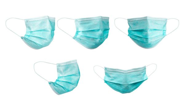Medical face mask isolated on white background with clipping path around the face mask and the ear rope. Concept of COVID-19 or Coronavirus Disease 2019 prevention by wearing face mask. - Photo, Image