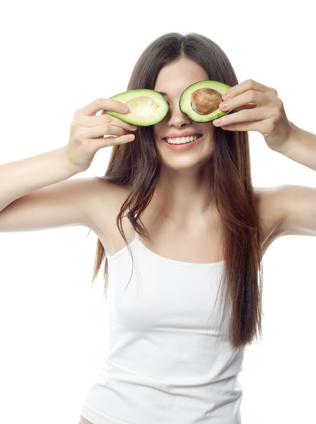Donna sorridente con avocado
 - Foto, immagini