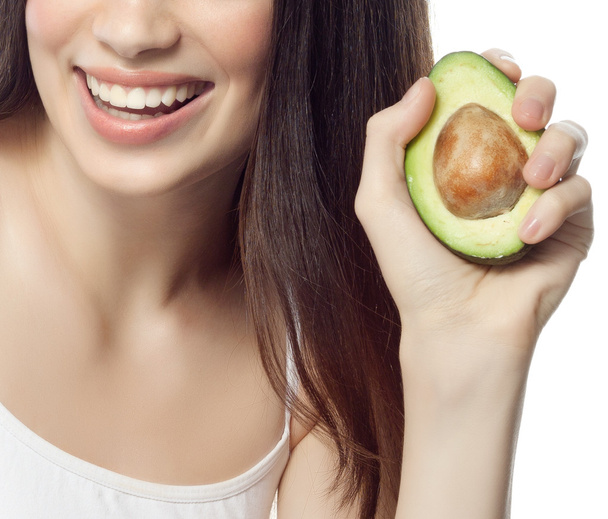 Smiling woman with with avocado - Valokuva, kuva