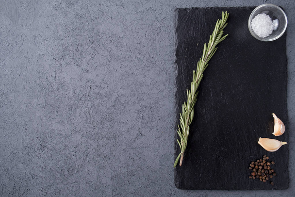 Stone  board with herbs and spices. Top view with copy space. Space for text. Rastaurant concept - Photo, Image