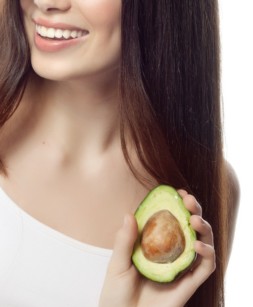 Smiling woman with with avocado - 写真・画像