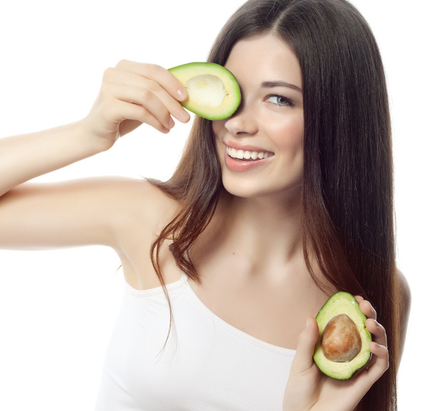 Smiling woman with with avocado - Фото, зображення