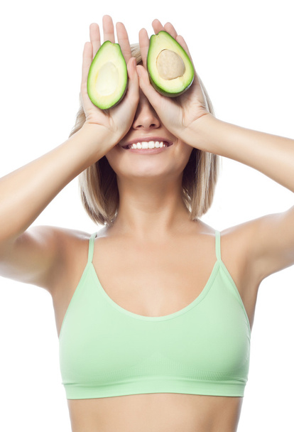 Woman with avocado - Photo, image