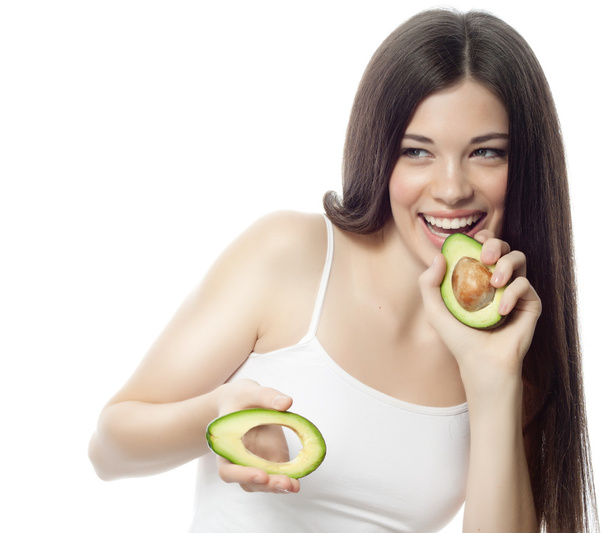 Smiling woman with with avocado - Foto, imagen