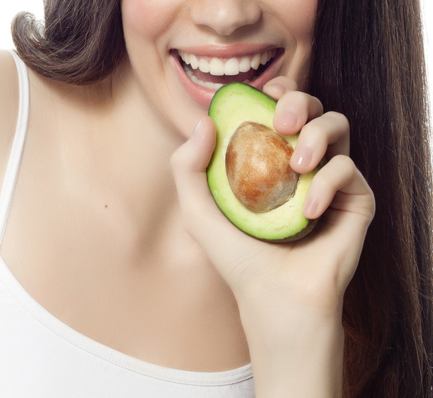 Smiling woman with with avocado - Zdjęcie, obraz