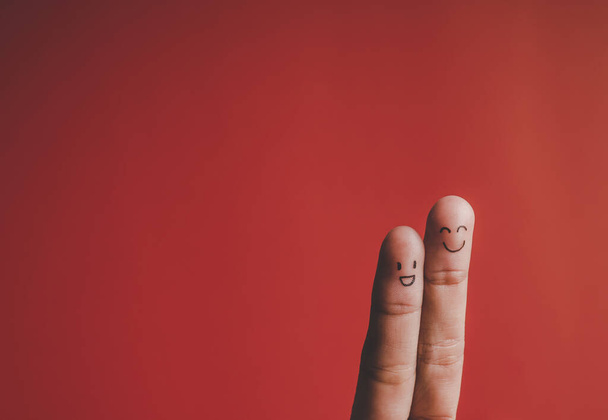 Finger with emotion on red background - Foto, immagini