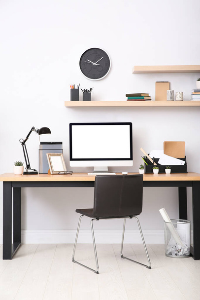 Modern computer on table in office interior. Stylish workplace - Zdjęcie, obraz