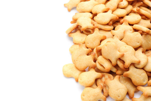 Delicious crispy goldfish crackers on white background, closeup - Photo, image