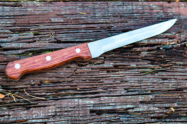 Knife on the Wooden Background closeup - Foto, Imagen