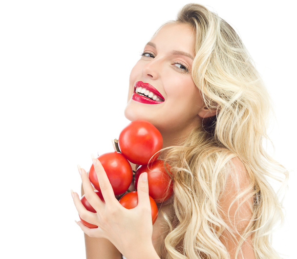 Smiling woman with tomatos - Φωτογραφία, εικόνα