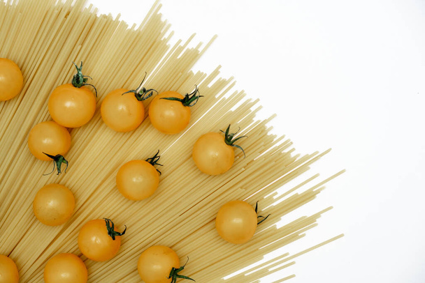 Background image of pasta and tomatoes on white. Food Delivery, Donation, Coronavirus Quarantine. Copy space - Photo, Image