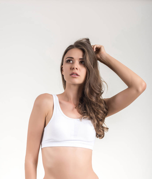 Beautiful woman with healthy body on white background - Фото, зображення