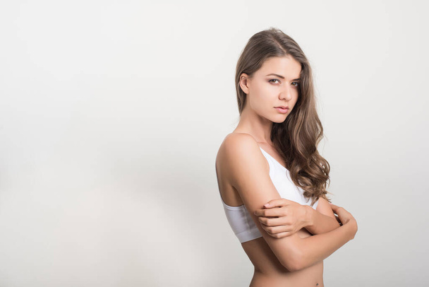 Beautiful woman with healthy body on white background - Fotografie, Obrázek