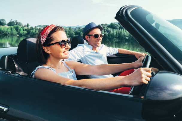 Couple in love ride in cabriolet car - Photo, image