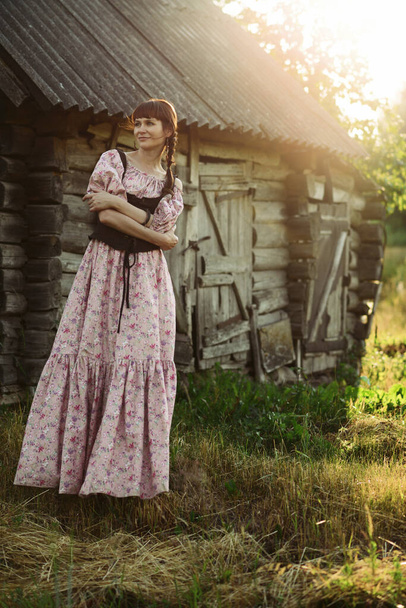 Pretty girl in long dress at the countryside - Foto, Imagem