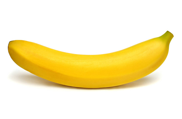 白い背景に1つのバナナを隔離。トップビュー、フラットレイ - 写真・画像