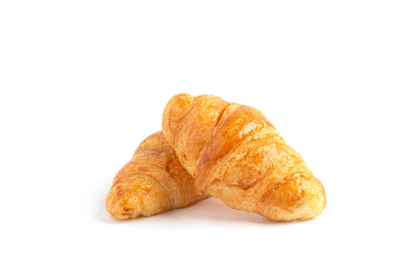 Délicieux croissants frais sur fond blanc. Croissants isolés. Petit déjeuner français - Photo, image
