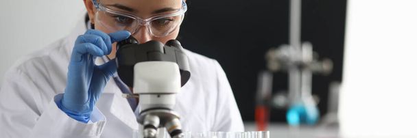 Scientist using microscope - Fotó, kép