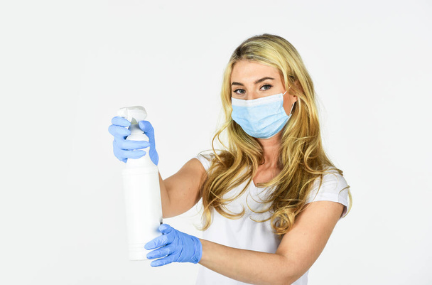 Personal hygiene. Serious hygiene. Disinfection concept. Girl clean frequently touched surfaces. Wearing mask protect from coronavirus. Risk being exposed coronavirus. Cleaning and Disinfection - Zdjęcie, obraz