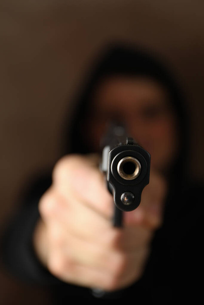 Man hold pistol. Selective focus. Robber. Violence - Foto, imagen