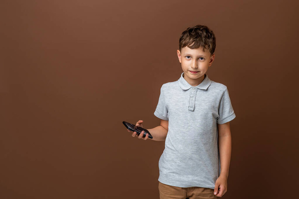 scared little boy, in shock from fact that I accidentally spoiled smartphone. Portrait frustrated kids with broken mobile phone. sad child broke mobile phone screen. cracked display in hands children. - 写真・画像