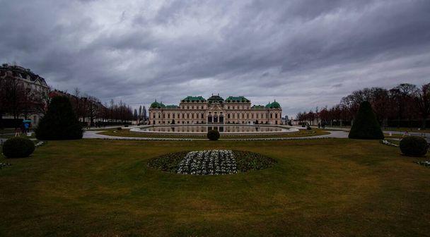 A view of Belvedere palace garden in Vienna, Austria with a cloudy sky in the background - 写真・画像