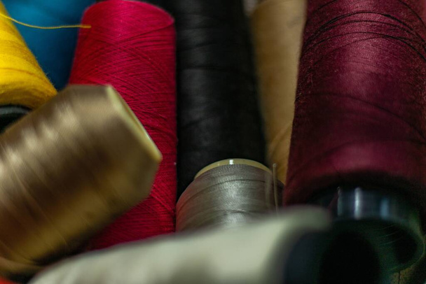 A closeup shot of colorful threads stacked on top of each other - Фото, изображение
